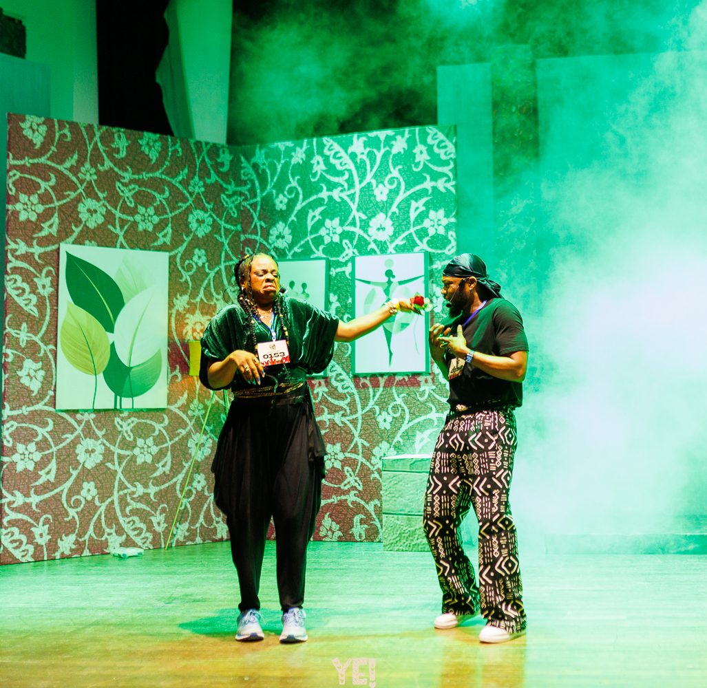 A comic audition moment between two performers in YE!